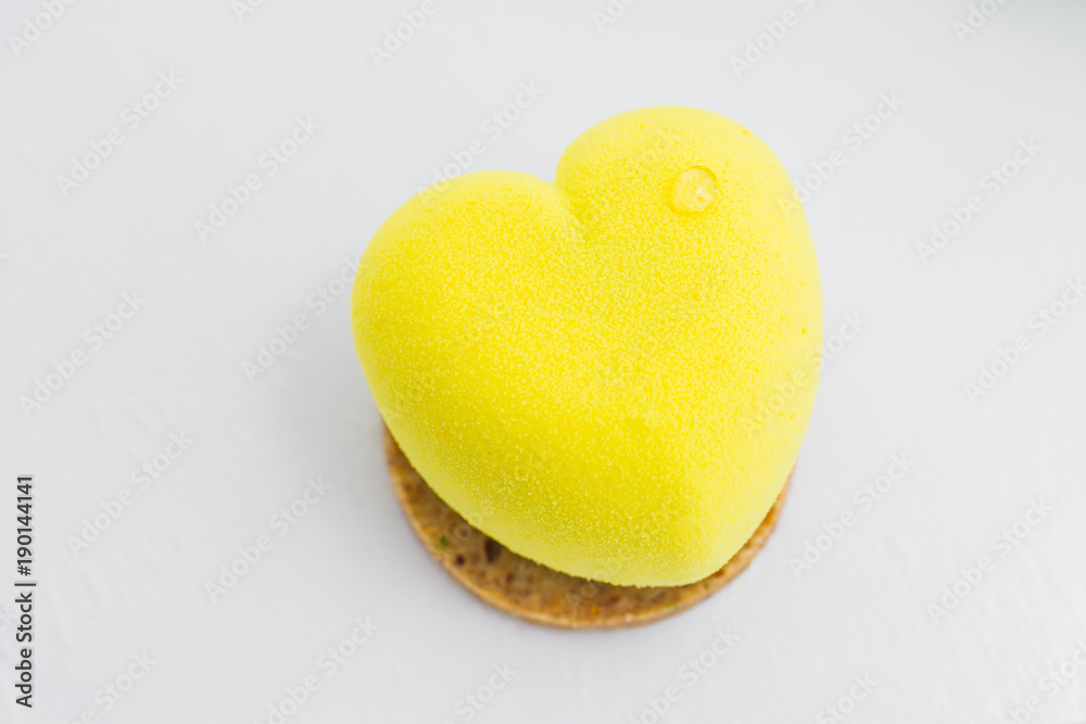 Yellow cake in the shape of heart. lemone desert Yellow cake in the shape of heart. lemone desert