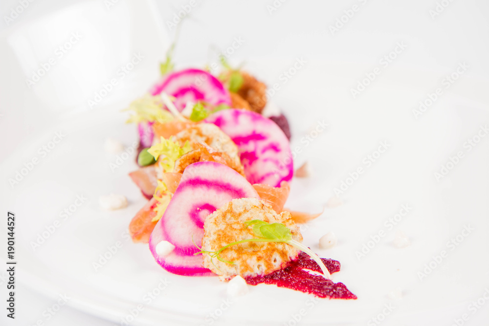 Smoked salmon with roasted beetroots sauce, russian pancakes and horseradish cream