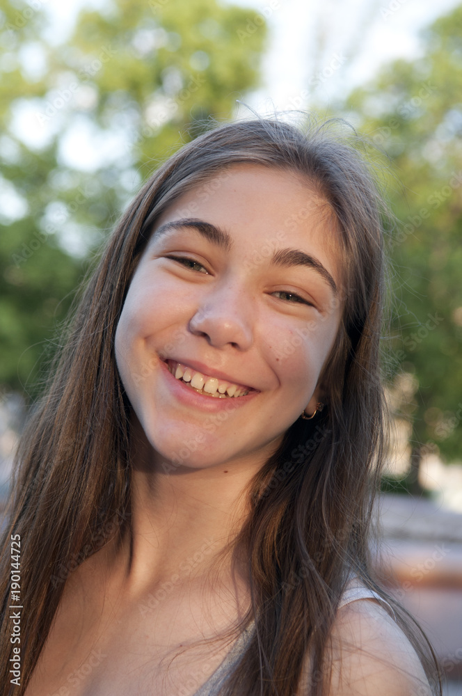 Closeup portrait of charming young female smiling Closeup portrait of charming young female smiling