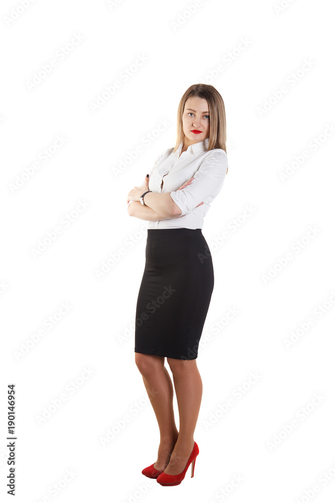 Young beautiful blonde girl in business suit stands sideways and looks at the camera, on a white background. Isolate. Space for text. Businesswoman Young beautiful blonde girl in business suit stands sideways and looks at the camera, on a white background. Isolate. Space for text. Businesswoman