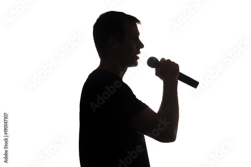 Young man singing into the microphone