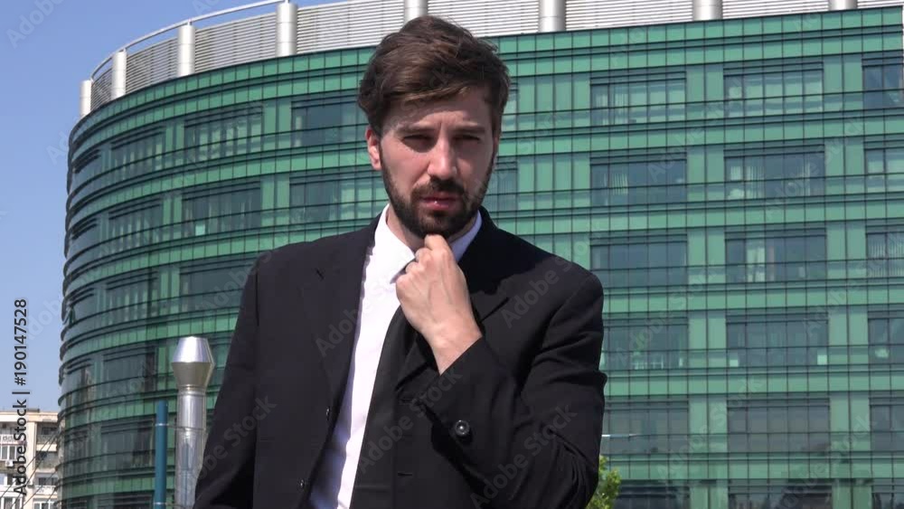 Worried tired depressed business man manager outdoors suit corporation thinking Worried tired depressed business man manager outdoors suit corporation thinking