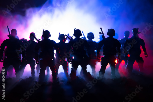 Wallpaper Mural War Concept. Military silhouettes fighting scene on war fog sky background, World War Soldiers Silhouettes Below Cloudy Skyline At night. Attack scene. Armored vehicles. Tanks battle. Torontodigital.ca