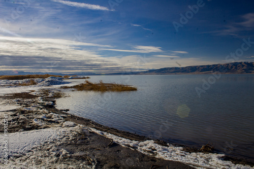 1/27/2018-Benjamin, Utah/USA- Ice sheets stacked along the edge of Utah Lake creating a tranquil feeling