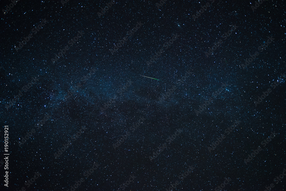 A shooting star flying across the Milky Way. 