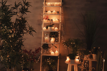 Burning candles as decor in room interior