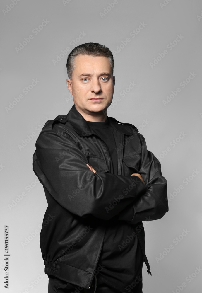 Obraz premium Male security guard on grey background