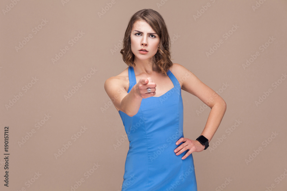 I'm choosing you! Well dressed woman pointing finger at camera