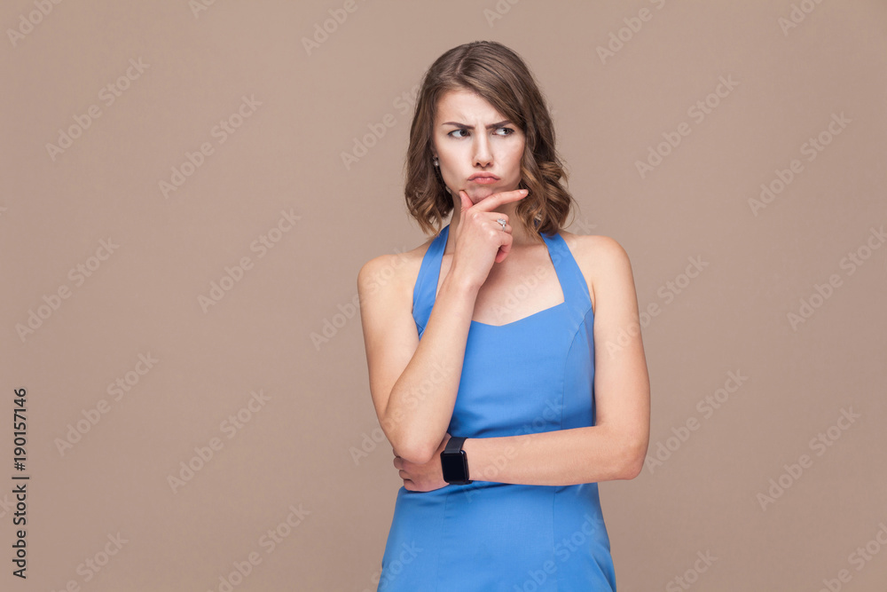 Thoughtful business woman looking up and thinking. Thoughtful business woman looking up and thinking.