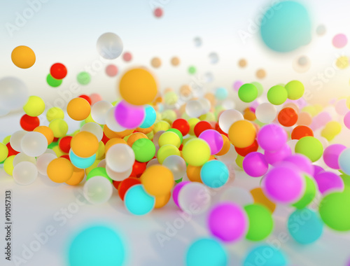 colorful bouncing balls outdoors against blue sunny sky