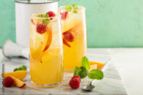 Colorful refreshing cold summer drink with peaches