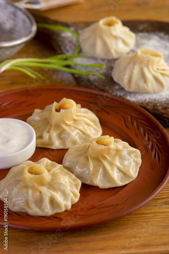 Uzbek manti with sour cream