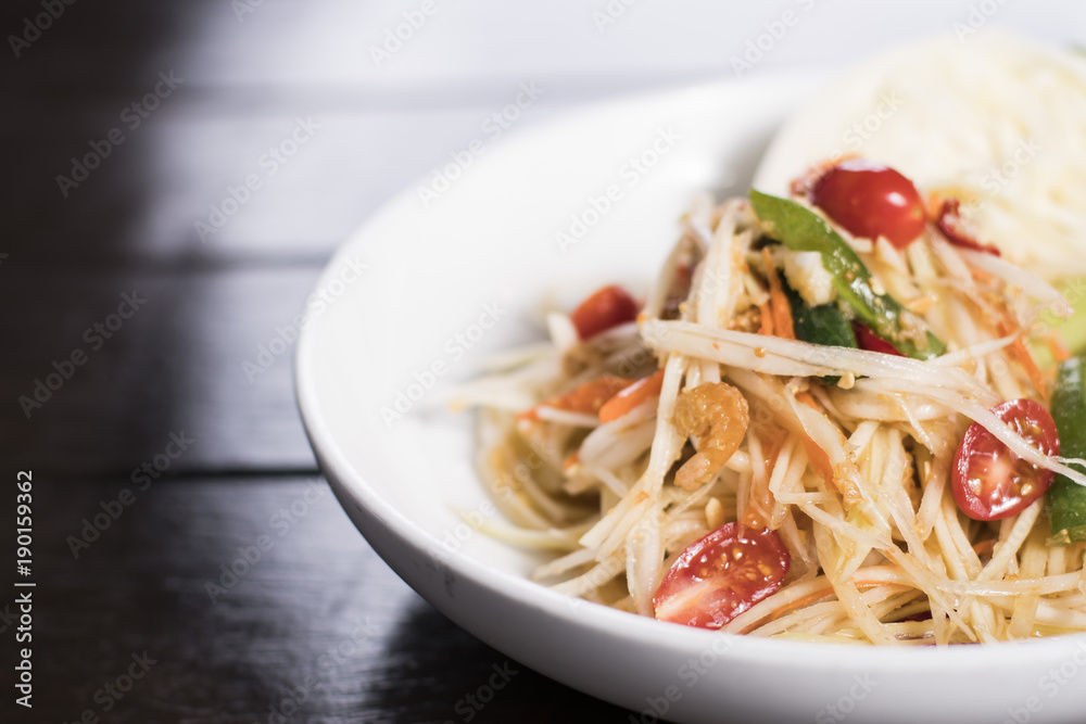 Som Tum or papaya salad served with fresh vegetable Som Tum or papaya salad served with fresh vegetable