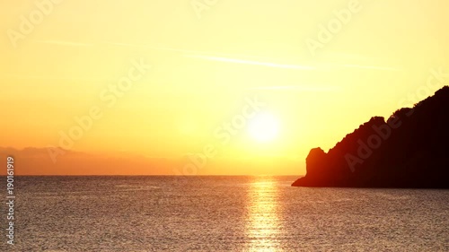 Scenic sunrise sun rising over sea surface, Greece Peloponnese Lakonia, Vlychada Beach, Richea. Timelapse 4K ProRes HQ codec