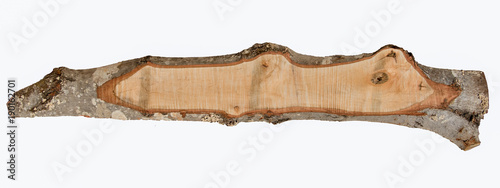 Isolated rough sawn red maple board with bark edge