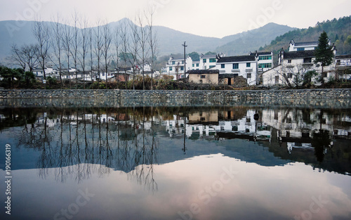 Peaceful Hongguan village with reflections in river, Wuyuan landscape in Jiangxi.