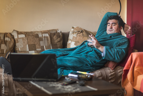 Lazy mature obese man photo