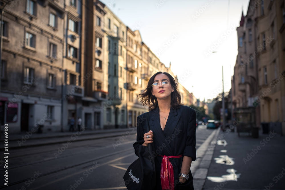 Woman walking on the streets of Prague full of multiculturalism
