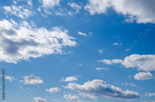 blue sky with stratocumulus and cumulus clouds on a day