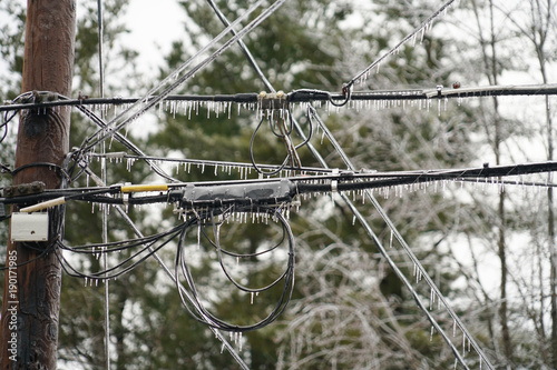 Icicle on power line in the frozen rain photo