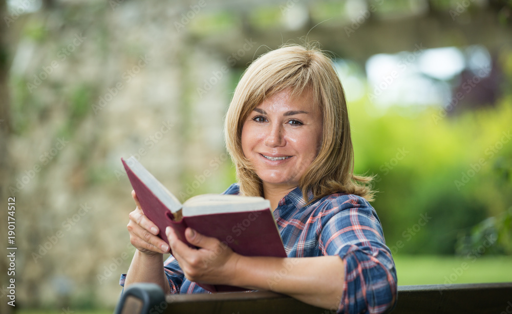 woman reading outdoors