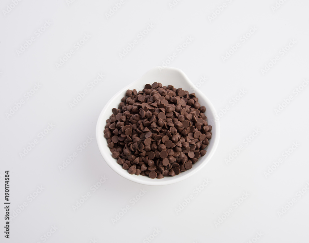 Chocolate chip morsels spread on a background. Chocolate chip morsels spread on a background.
