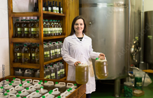 girl having olive oil containers
