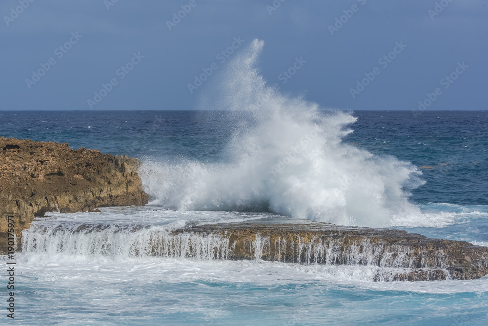 Panorama of the sea which smashes against rocks
