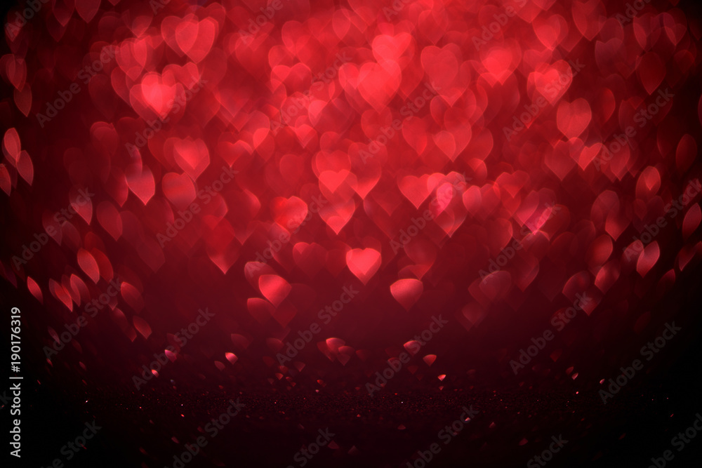 Fototapeta Red Blur heart shape of ligth bokeh on a black background.