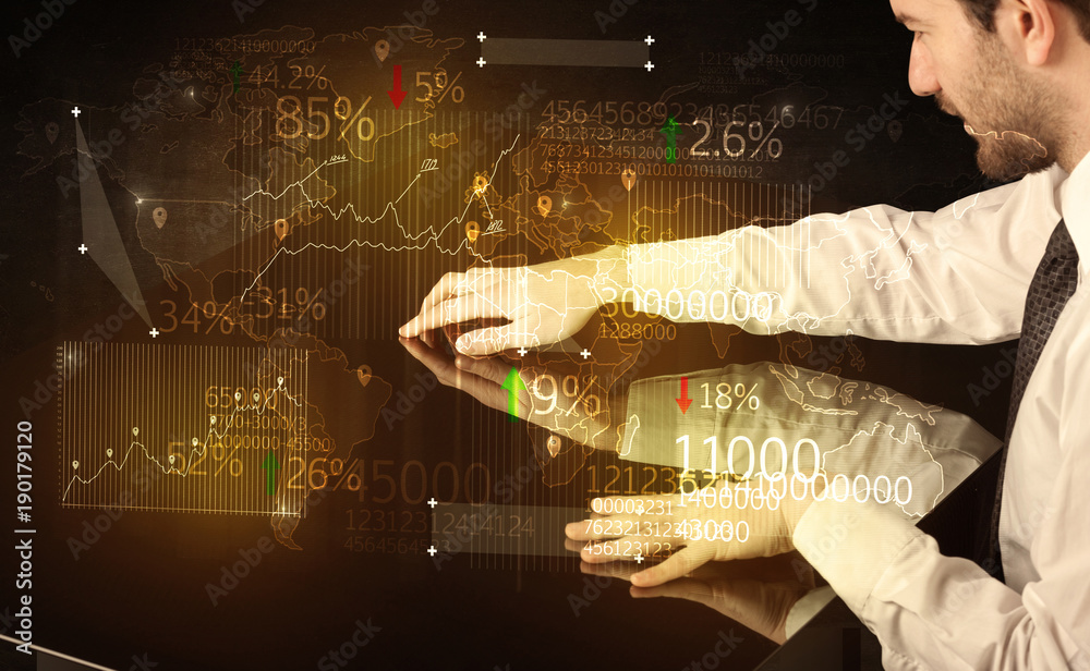 Fototapeta premium Hands navigate on high tech smart table with business icons