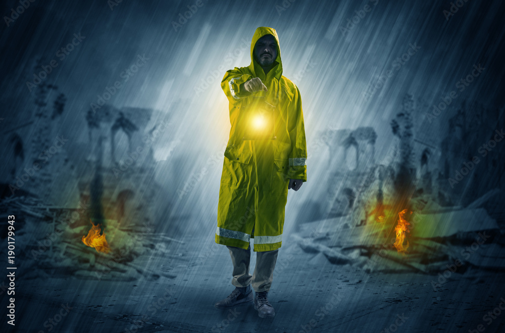 Fototapeta premium Man with a glowing lantern at a catastrophe scene