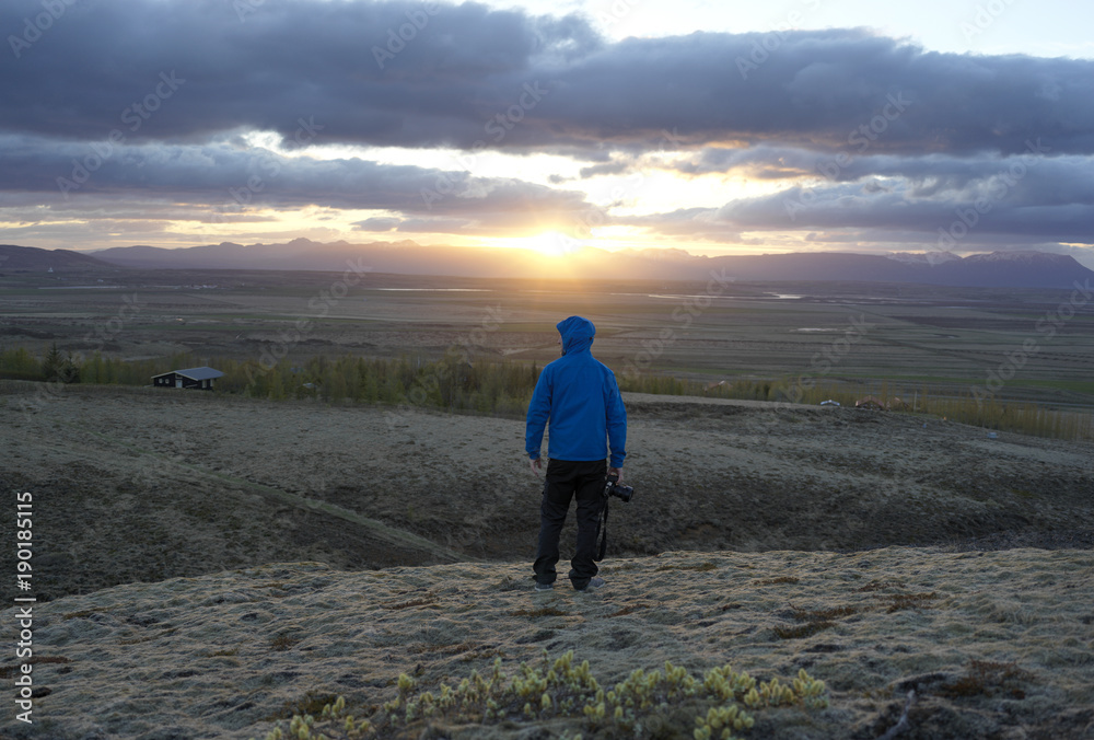 Man looking at sunset on Iceland 