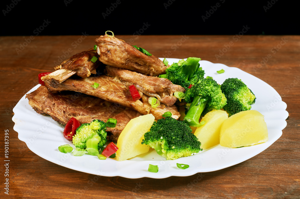 roasted pork ribs with potatoes and vegetables roasted pork ribs with potatoes and vegetables