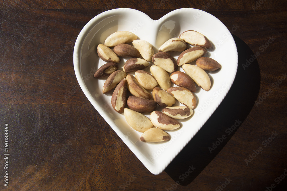Fresh Brazil Nuts served in a heart shaped plate Fresh Brazil Nuts served in a heart shaped plate