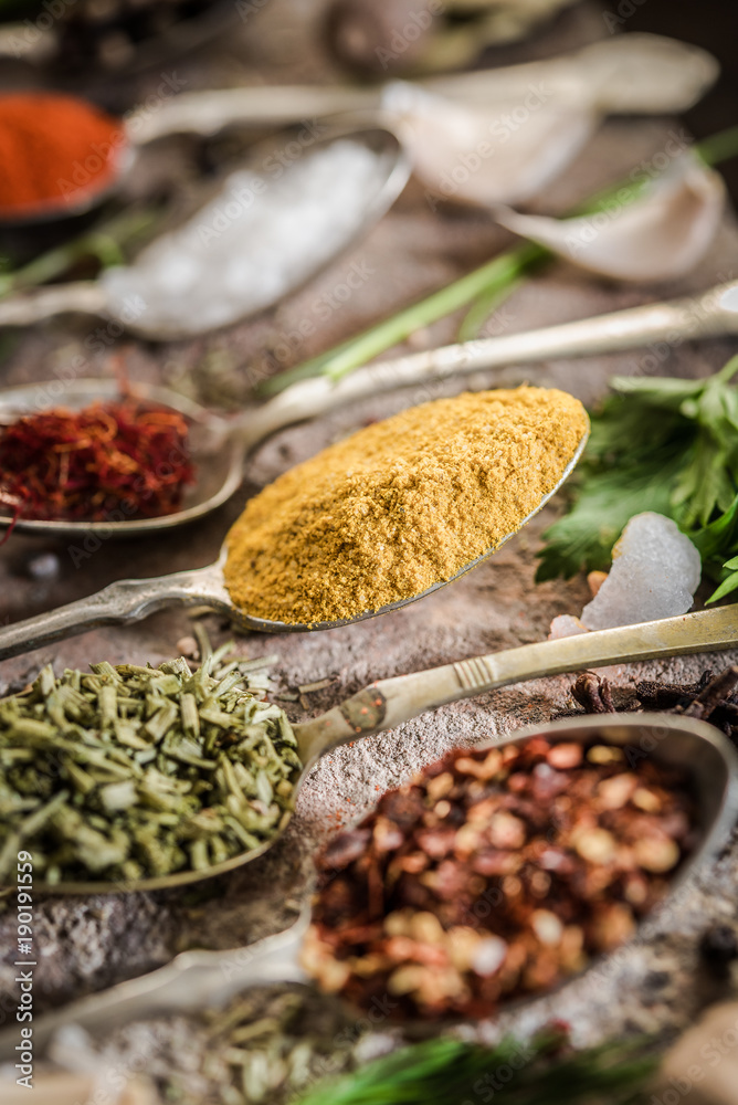 Intensive condiments on old spoons Intensive condiments on old spoons