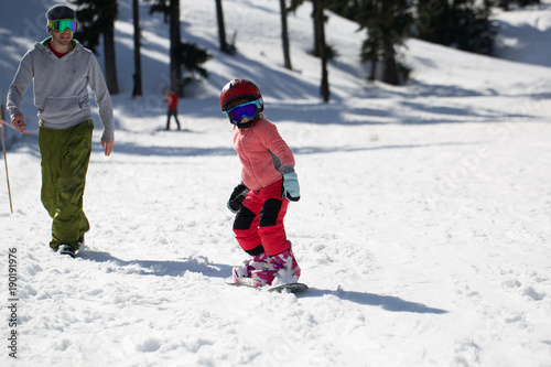 At Sunny Cold Winder Day at Mountain Ski Resort Mount Hood Meadows Oregon Father Teaching Little Daughter Snowboarding 