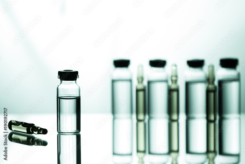 Group of ampoules with a transparent medicine in medical laboratory Group of ampoules with a transparent medicine in medical laboratory