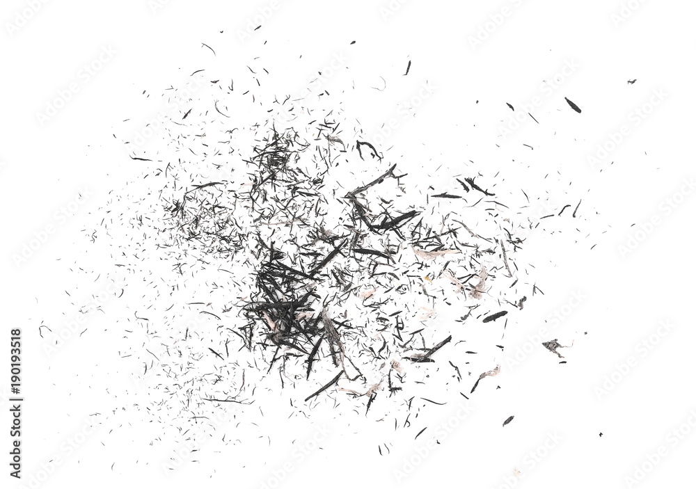 Graphite stained eraser shavings isolated on white background, top view