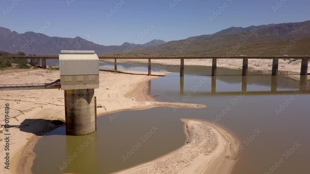 Aerial view of a dam with low levels