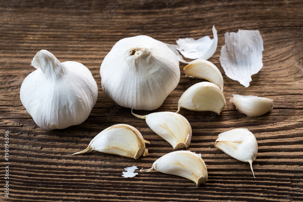 Garlic bulbs. Fresh garlic on the wooden table. Garlic bulbs. Fresh garlic on the wooden table.