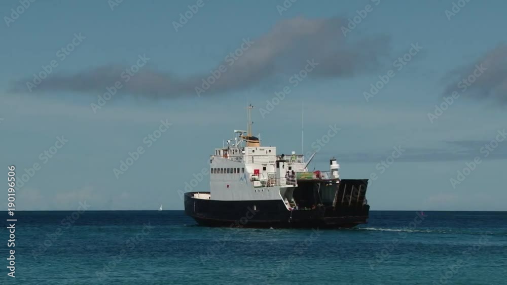 Local ferry sailing away Mayreau island, St Vincent and the Grenadines Local ferry sailing away Mayreau island, St Vincent and the Grenadines