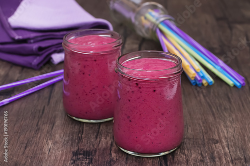 Berry smoothies in glass bowls.