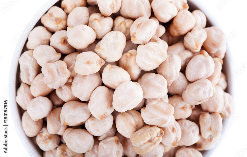 Raw dry chickpeas in bowl on white background Raw dry chickpeas in bowl on white background