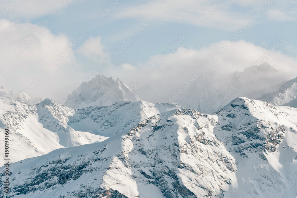 Naklejka premium Snow-capped peaks of the Caucasus Mountains. Caucasian landscape