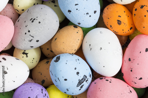 Colorful quail eggs. Easter background. 