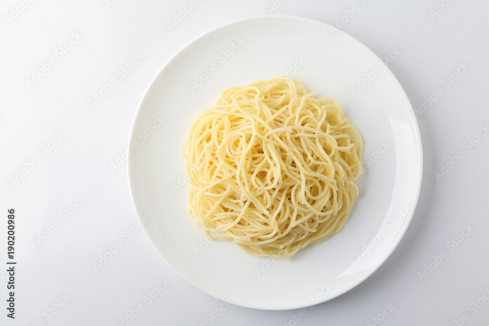 A plate of spaghetti pasta isolated on white background. A plate of spaghetti pasta isolated on white background.