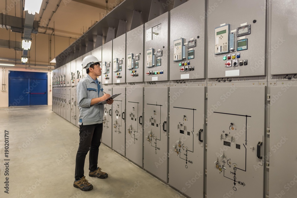 Engineer working and check status switchgear electrical energy