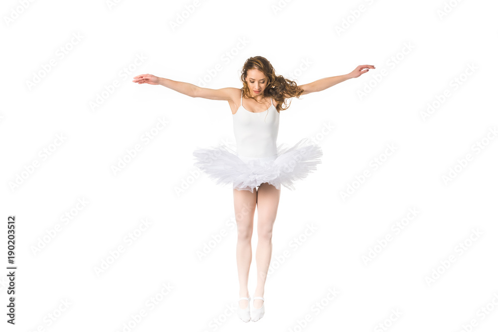 young ballerina with open arms jumping and looking down isolated on white young ballerina with open arms jumping and looking down isolated on white