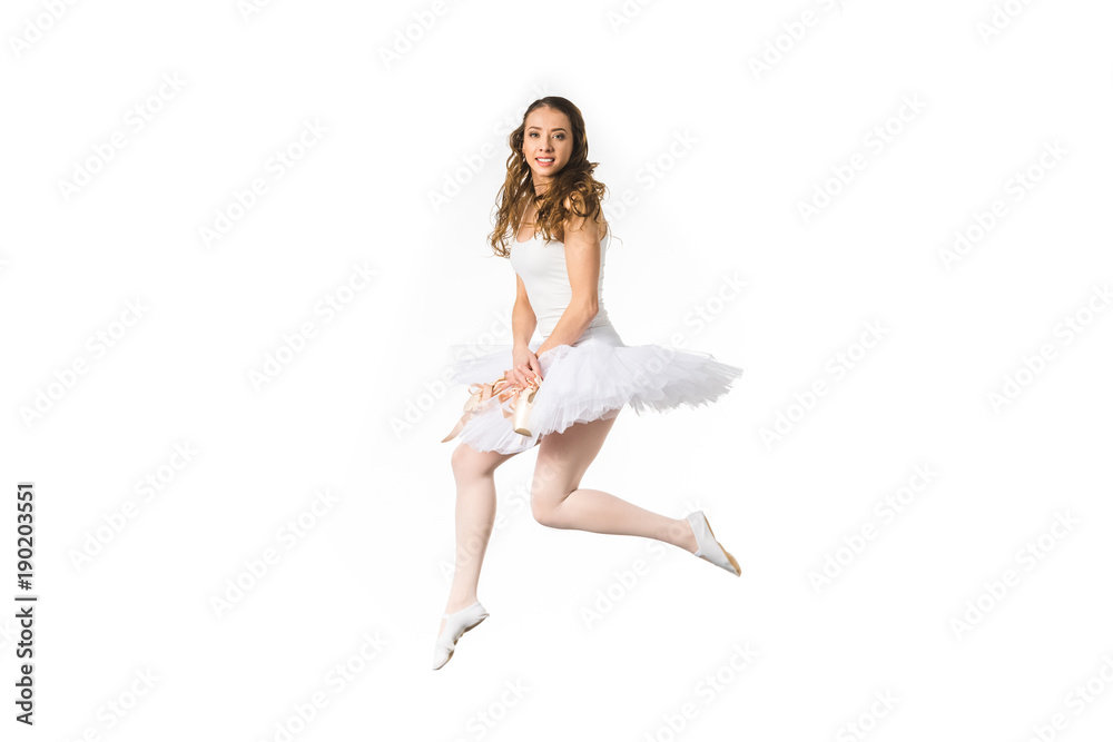 beautiful young ballerina jumping and smiling at camera isolated on white beautiful young ballerina jumping and smiling at camera isolated on white