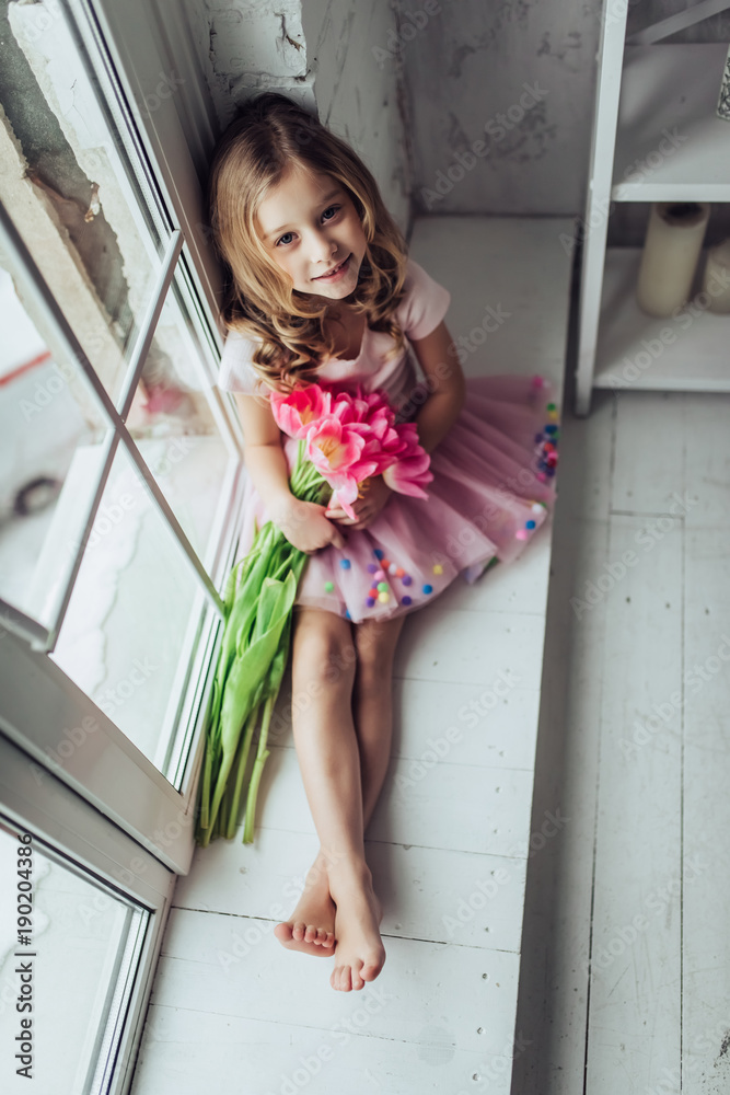 Cute little girl at home Stock Photo | Adobe Stock